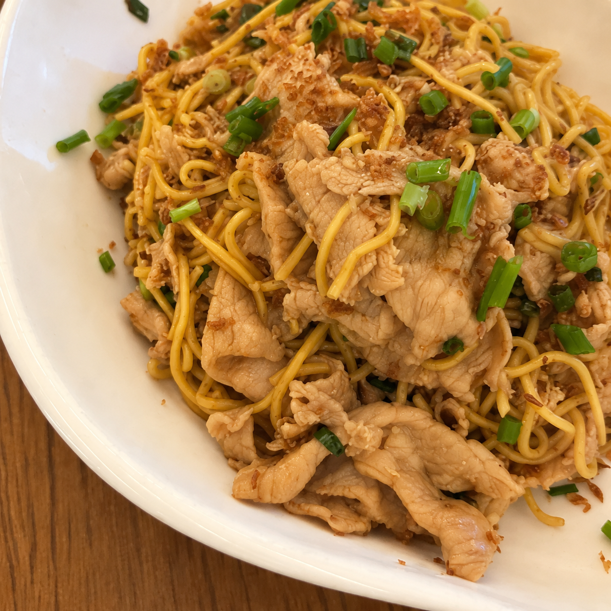 Noodles with sliced meat and spring onions at Dim Tao — AI-assisted edit