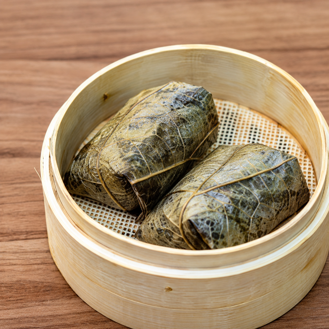 Two leaf-wrapped parcels in a bamboo steamer at Dim Tao — AI-assisted edit