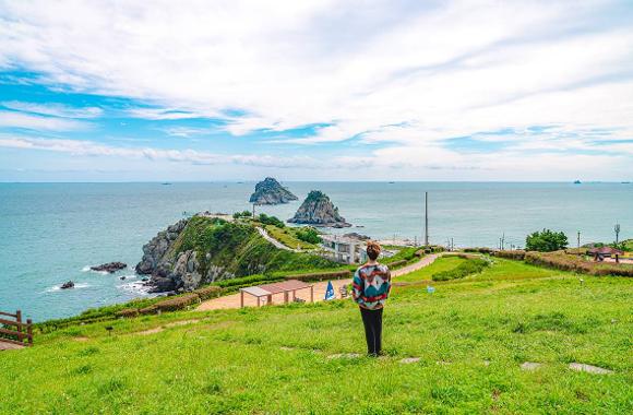 Oryukdo islets and the sea beyond a grassy coastal viewpoint