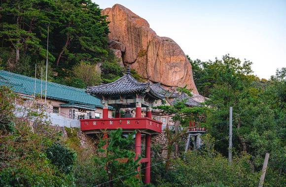 Seokbulsa temple buildings beneath tall rock faces