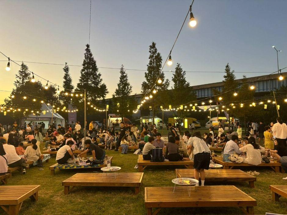 Picnic tables and string lights at the 2025 Starry Night Busan Night Market