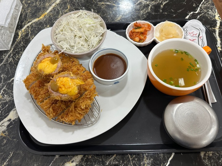 Pork cutlet with shredded cheese, cabbage and dipping sauce at Mueun in Busan