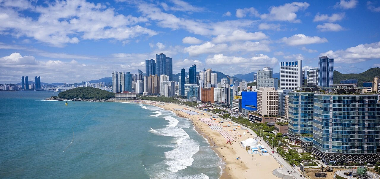 Haeundae Beach and Busan’s skyline curving around the blue bay
